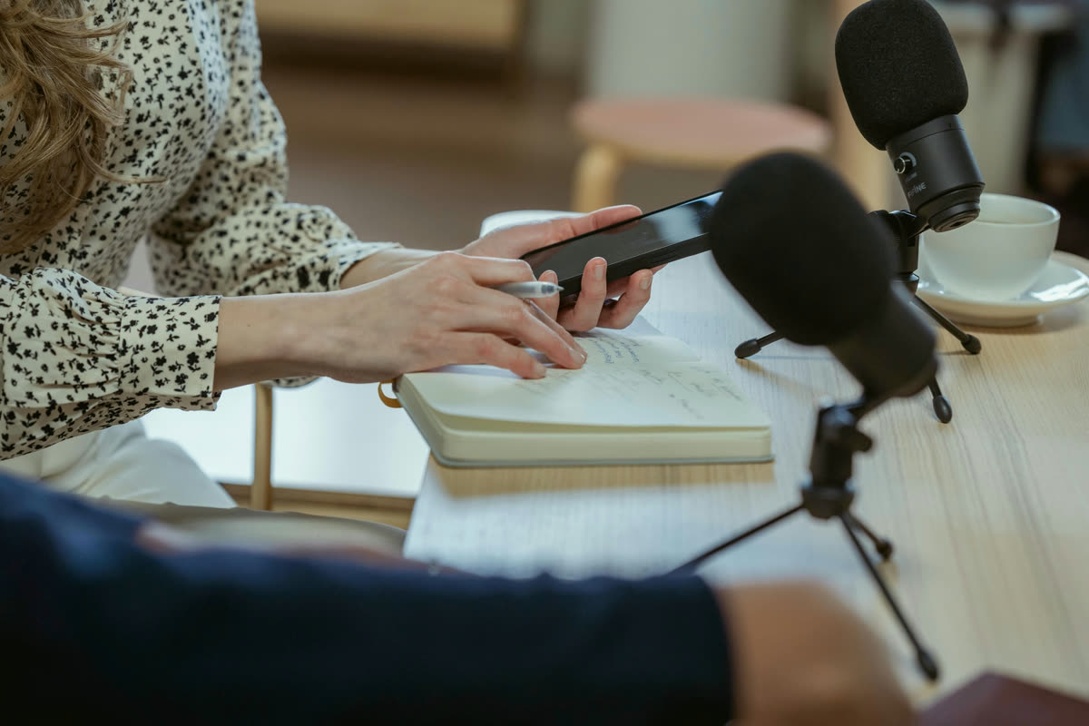 Microphones, notes, and a phone set up for Spanish speaking practice